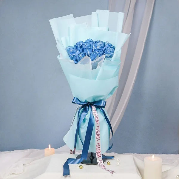 20 blue rose bouquet wrapped in light blue paper front view