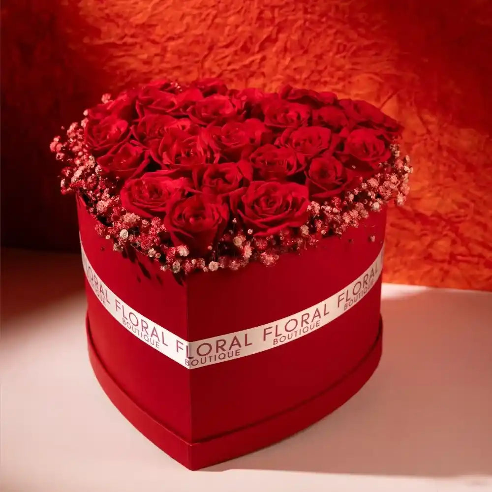 25 red roses in a red heart shaped box front view 2