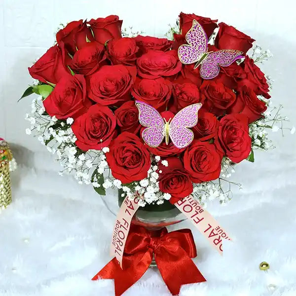25 red roses in glass vase front view