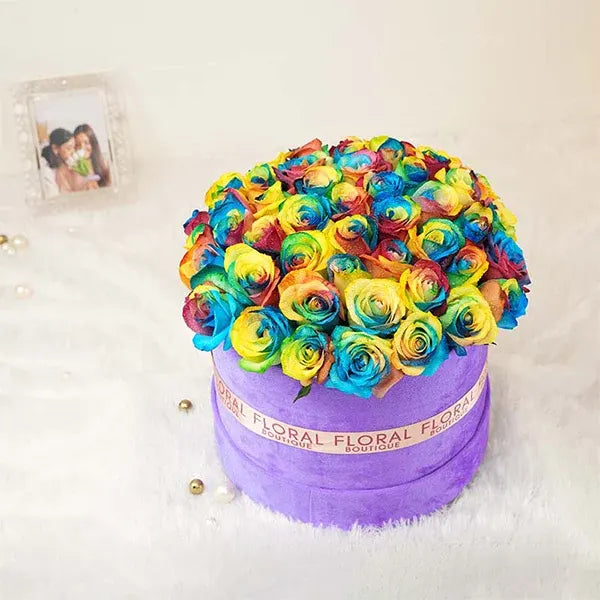 rainbow roses in purple box arrangement front view 2