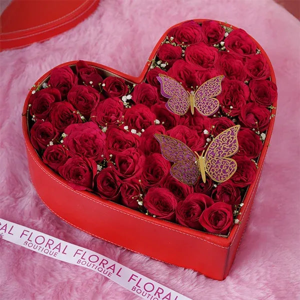 50 red roses in leather heart box with butterflies top view