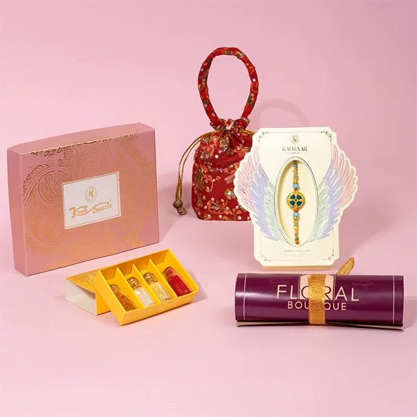 aqua divine rakhi with kanti kaju katli and roli chawal front view