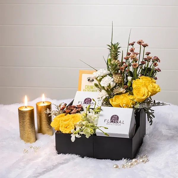 yellow roses white carnations flower with hazelnut chocolate in black box front view