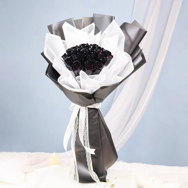 20 Black rose bouquet wrapped in black and white paper top view