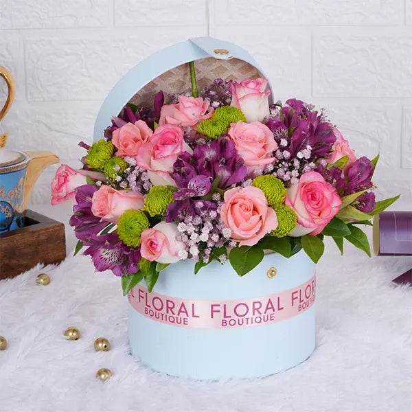 jumeila baby pink roses pink alstroemeria in a light blue gift box front view 2