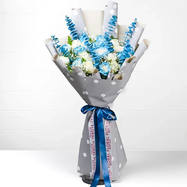 blue and white rose bouquet with elegant wrapping front view 2