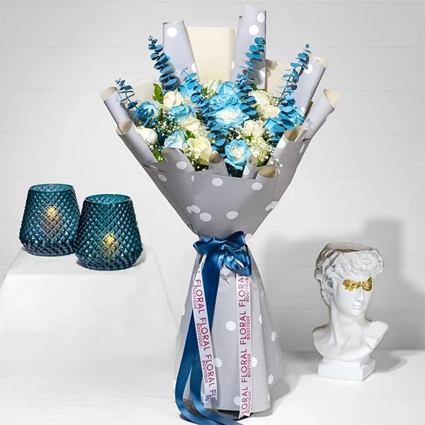 blue and white rose bouquet with elegant wrapping front view