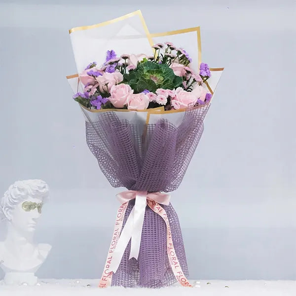 blush pink rose bouquet with brassica charm front view