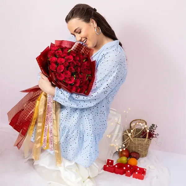 bouquet of 50 red roses? wrapped in red and gold paper front view 2