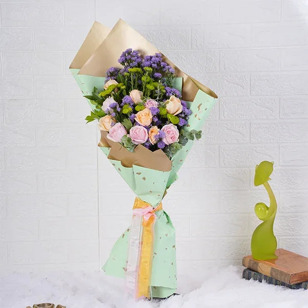 flower bouquet of peach roses sweet pink roses blue daisy front view