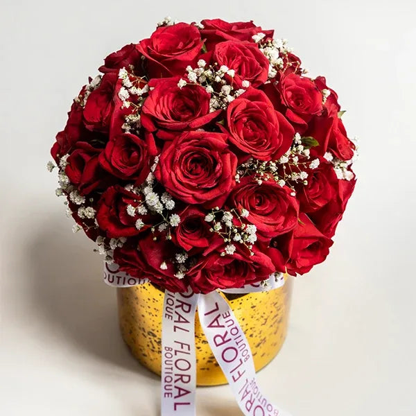 30 red roses and gypsophila in a glass vase top view