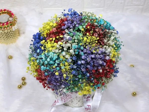 colored gypso in sliver glass vase closeup view