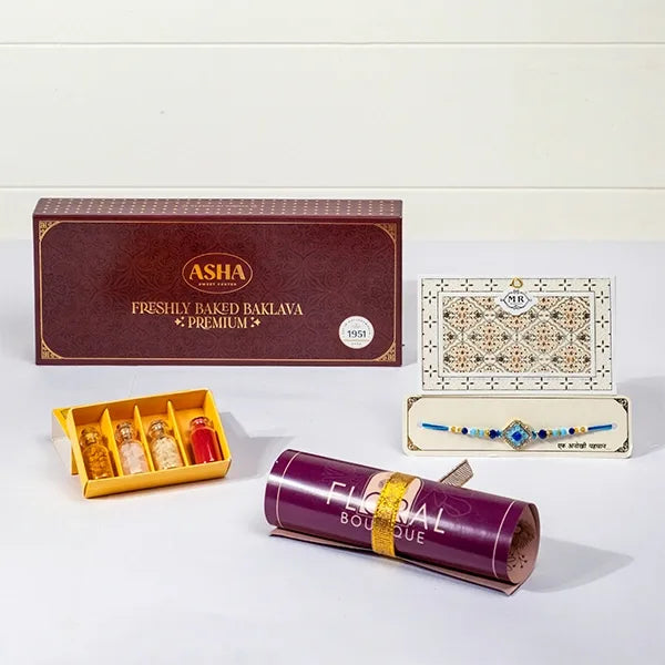 distinctive azure rakhi with asha baklava & roli chawal front view