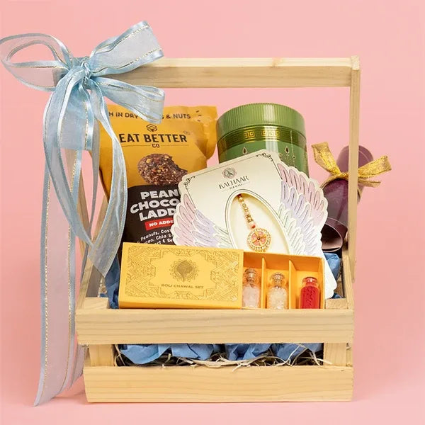 divine chakra rakhi with millet laddu & almonds hamper basket view