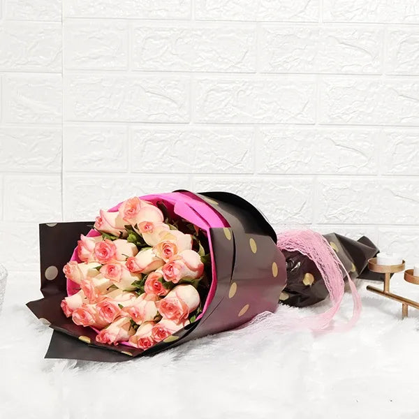 elegant jumilia pink rose bouquet in pink and black wrap front view 2