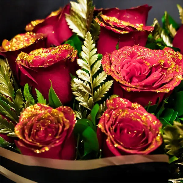 elegant red rose bouquet with golden touch close up view