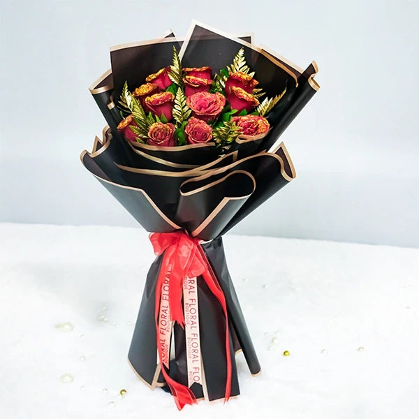 elegant red rose bouquet with golden touch front view