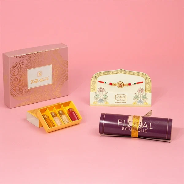 ethnic charm rakhi with kanti kaju katli and roli chawal front view