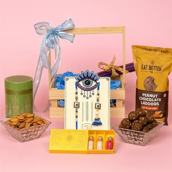 grand rakhi hamper evil eye set millet laddus almonds more! front view
