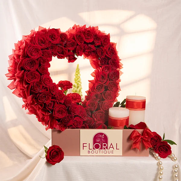 heart shaped arrangement with 60 red roses front view