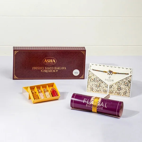 lucky elephant rakhi with asha baklava roli chawal front view
