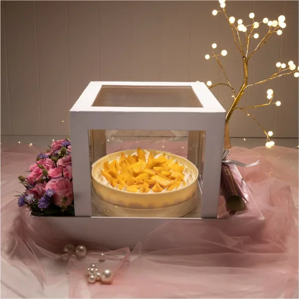 mango cream cheese half kg cake with white chocolate box view