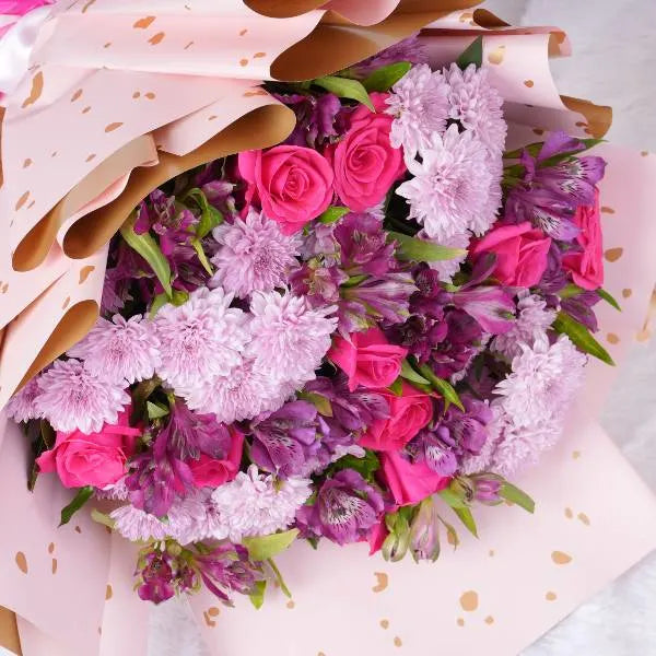 mix flowers bouquet of dark pink roses pink mums alstroemeria top view