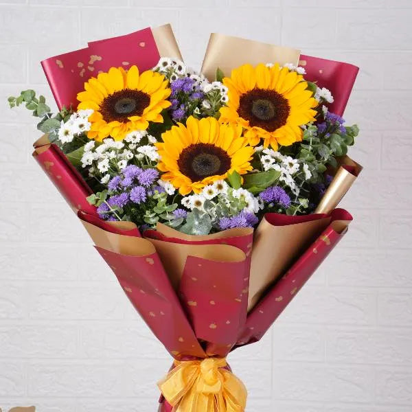 mixed flower bouquet of sunflowers white santon and blue daisies front view