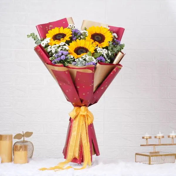 mixed flower bouquet of sunflowers white santon and blue daisies front view