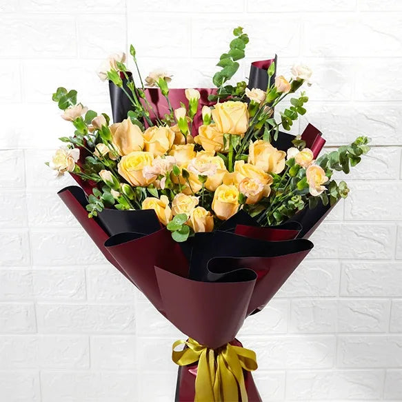 charming peach roses bouquet with spray carnations closeup view