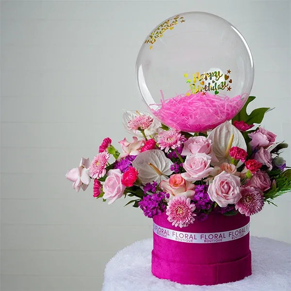 pink box with sweet avalanche red jumelia roses dark pink carnations clear balloon front view 2