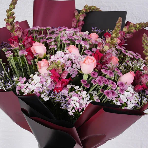 pink flowers bouquet of chrysanthemum baby pink roses pink snapdragon close up view 2