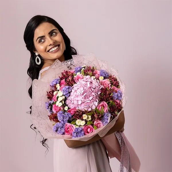 mix flower bouquet of rival rose dark pink alstroemeria blue daisy top view