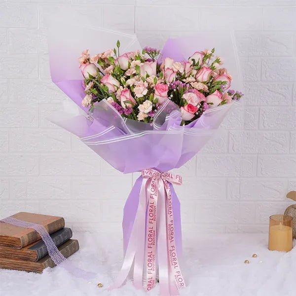 pink roses bouquet with spray carnations front view