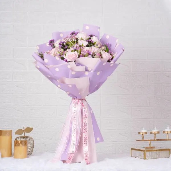 bouquet of pink roses alstroemeria and gypsophila front view