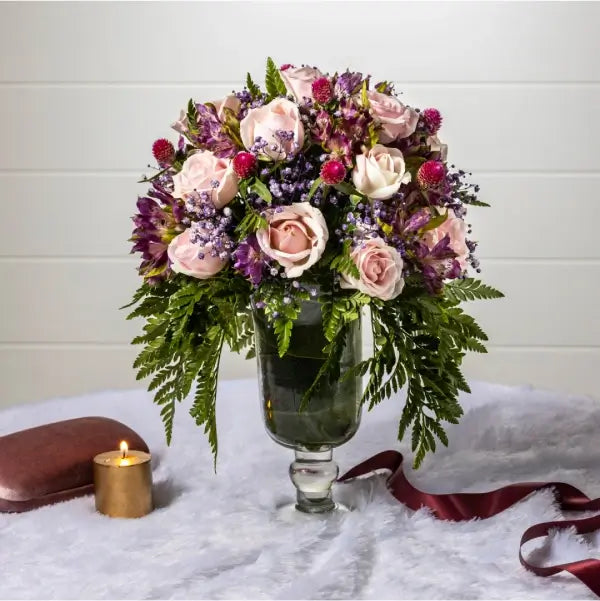 pink roses with purple alstroemeria in a glass vase front view 2