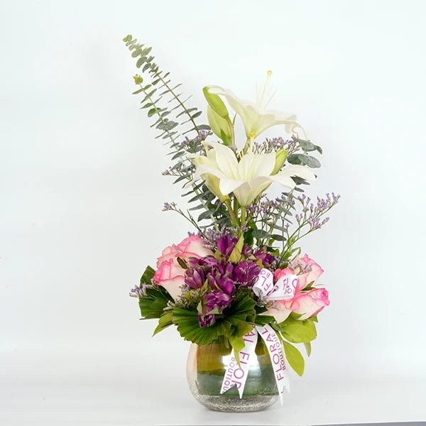 lilies roses alstroemeria in glass pot front view 2