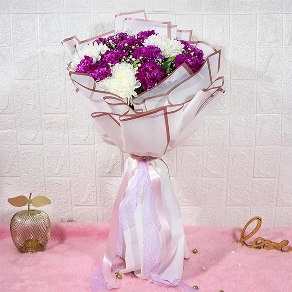 purple carnations bouquet with disbuds and gypsophila front view
