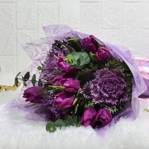 purple tulips bouquet with brassica close up view 2