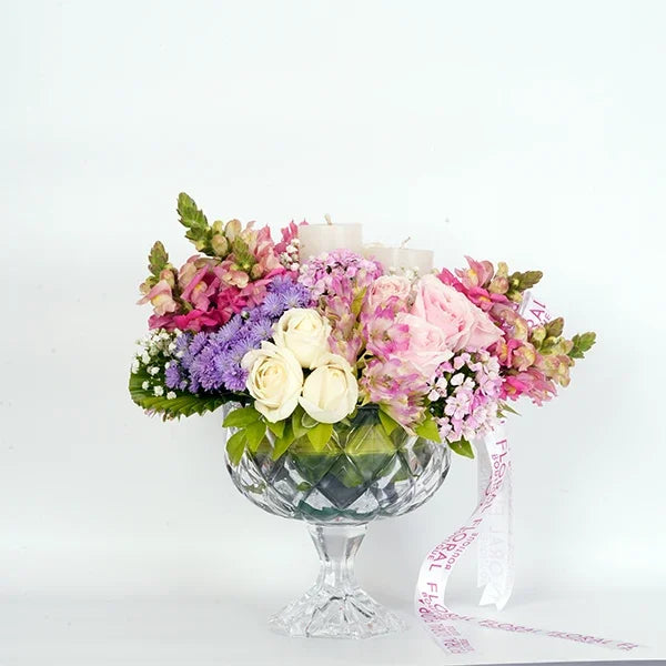 sweet avalanche roses snap dragons white roses in crystal glass vase front view 2