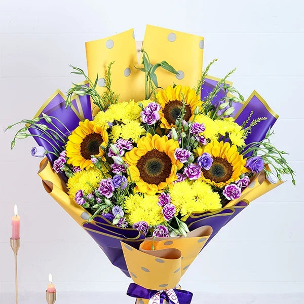 sunflower bouquet with yellow and purple wrap top view