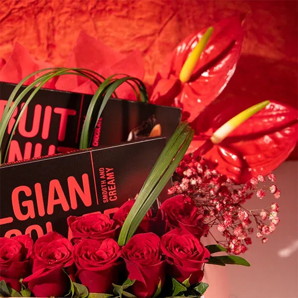 red roses anthurium chocolate in a box close up view