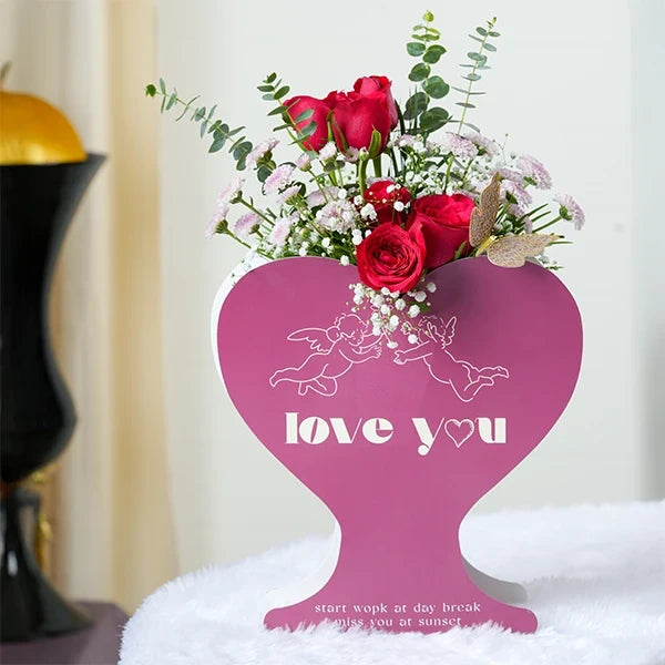 red roses with pink button chrysanthemums in pink heart shaped box front view