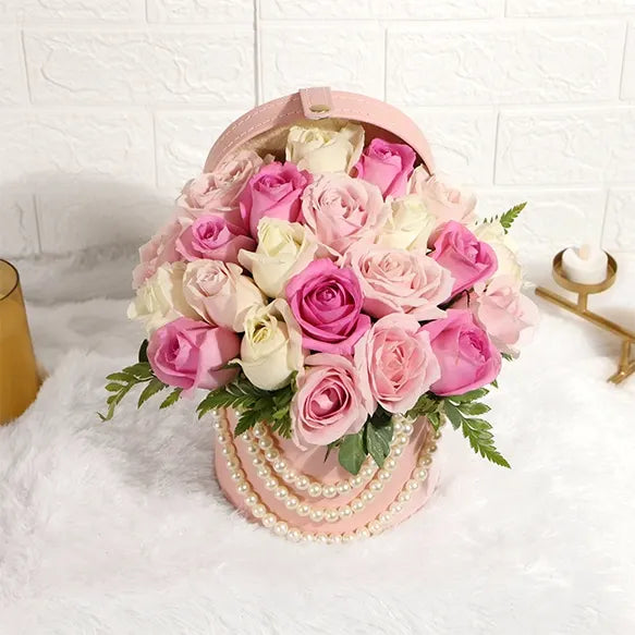 sweet white and pink roses in round box close up view