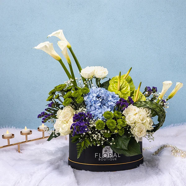 box arrangement of white calla lily white rose anthurium green front view