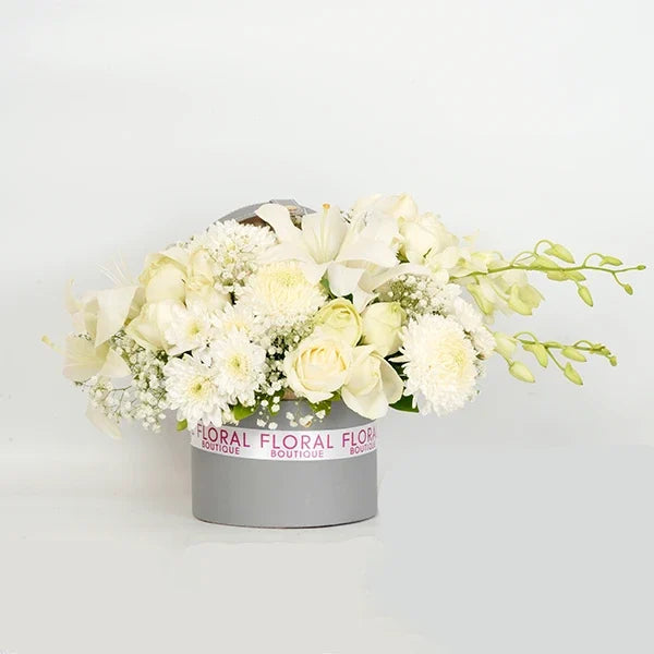 white roses asiatic lilies orchids in grey gift box front view 2