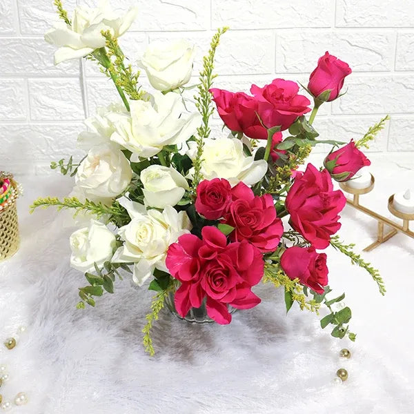 graceful white and dark pink roses in glass vase closeup view