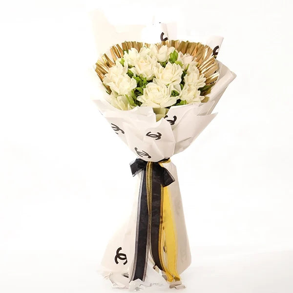 white rose bouquet with gold chain palm accents front view