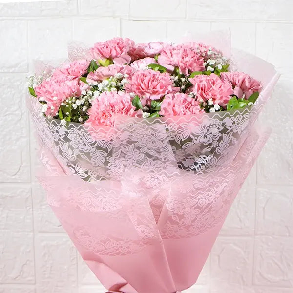 15 pink carnations bouquet with gypsophila close up view