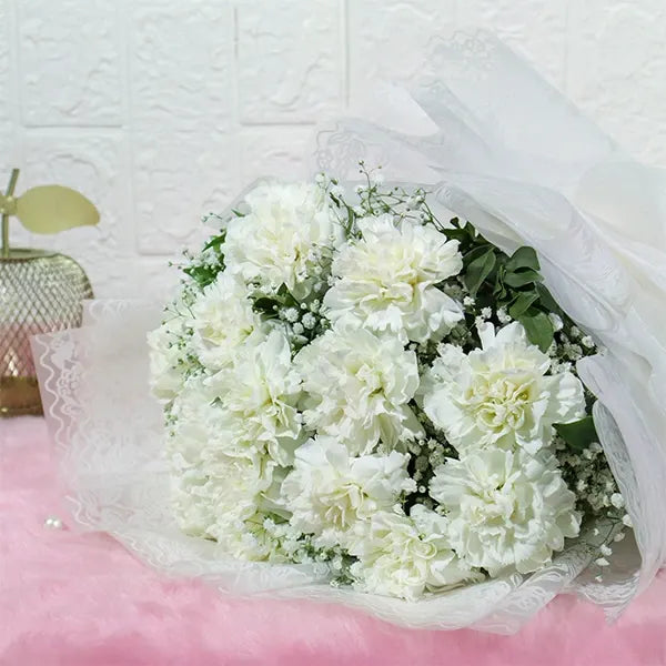 15 white carnations bouquet with gypsophila close up view